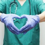 surgeon-making-heart-shape-with-hands