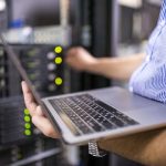 Engineer in the server room close-up